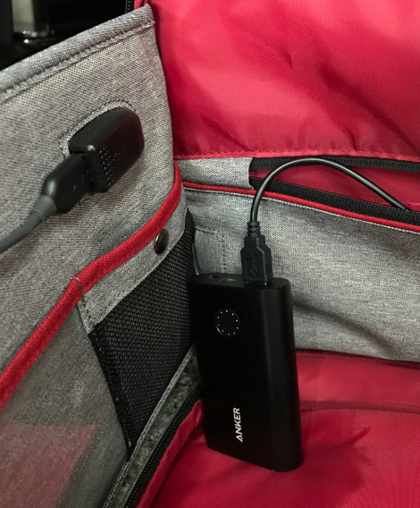 The passthrough USB port in action. Normally, the battery pack would live inside that back pocket.